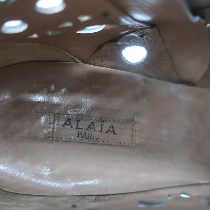 Bottes cheville Alaia en cuir vernis noir à découpes laser Taille 38.5 Bottines à talon haut