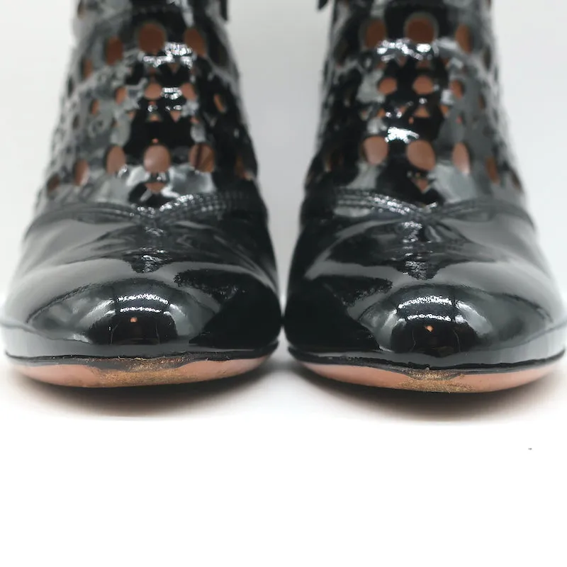 Bottes cheville Alaia en cuir vernis noir à découpes laser Taille 38.5 Bottines à talon haut